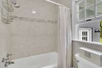 Primary bath with tub shower combo, beautiful tile