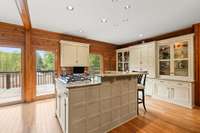 Built-in cabinets with glass shelves, offering abundant storage.