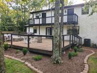 Spectacular spaces include a balcony accessed through two upstairs rooms, and a large contemporary styled custom deck (27'x24') - both shaded with trees.