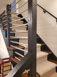 Custom modern staircase design at front entry