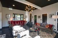 Centerpiece bay window behind the custom bar, bathroom to the right in photo