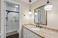 Full bath with walk-in shower on basement level.