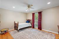 Another large secondary bedrooms on the main level with hardwood flooring.