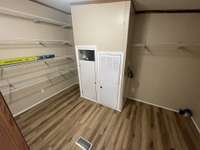 Large Utility Room with Washer & Dryer Hook-Ups and Eco Smart Tankless Water Heater & Huge Pantry Area Right off the Kitchen with an Exit Door to the Covered Back Deck.