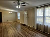 Another View of the Living Room and Front Door and Lots of Windows.