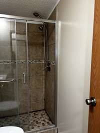 Tile Shower in Main Bath with Glass Shower Doors