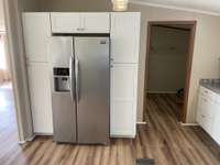 SS Refrigerator Surrounded by Pantry Storage Space