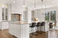 This large granite island is the perfect place for prep work and entertaining.