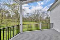 Large covered private balcony off secondary bedroom.