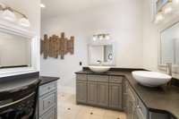 Leathered granite counters with dual sinks.  Additionally, lots of storage in these custom cabinets.