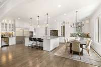 This spacious kitchen is a chef's dream - with beautiful custom cabinetry and 10 foot ceilings.