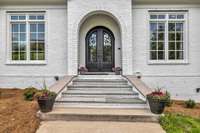 Enter this stunning estate through custom Iron 8' front double doors.