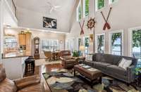 another angle of the living room with nonstop windows and views of the lake.