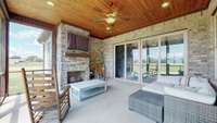 Screened in porch boasts the 2nd stacked stone gas fireplace, with tongue-in-groove ceiling, canned lighting and ceiling fan.  Doors open to the Great Room.