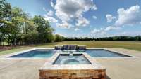 Beautiful view from the hot tub towards the back acreage.  This property goes all the way to the tree line, and makes an "L" shape