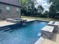 What a beautiful pool!  Heated, Salt-Water, with hot tub, 7' deep end, stamped concrete!