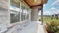 Rocking chair front porch, with tongue-in-groove ceiling.