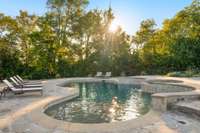 Spectacular heated saltwater pool surrounded by TN Blue Orchard flagstone, handmade porcelain tile, Pebble Tec lining, color-changing LED's, a spa with multiple jets and an overspill that you can control on demand from your phone!