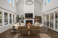 Warm and inviting living room with an abundance of natural light and soaring ceilings!