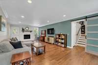 Great room with fireplace leads to deck-small stairs leads to Family room and separate office