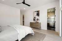 Another view of the primary bedroom leading into the primary bath.