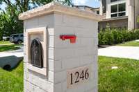 Stately custom brick mailbox with stone detail