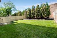 Plenty of space for a pool / playset / pets. Note the gorgeous 14 foot magnolias and arbor vitae!