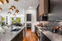 The epitome of modern luxury and understated elegance, this beautifully-appointed kitchen is an entertainer's dream