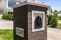 Striking custom brick mailbox with stone detail