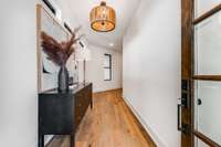 Beautiful entryway with plenty of room for a foyer furniture piece, mirror and art for an inviting entrance