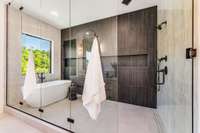 Fully enclosed frameless glass wet room in the primary bath is spectacular!