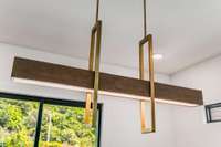 Tonbridge Linear dining room chandelier retails for over $3400! The lighting package throughout is stunning.