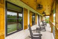 Large front porch with multiple ceiling fans and wood ceiling and spectacular views