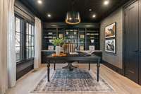 step up from the media room + enjoy the relaxed home office space with custom built-ins