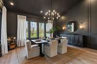 a dramatic dining room is adjacent to the kitchen. the space is open to the kitchen and living room for wonderful entertaining and the wall of windows provides a spectacular view.