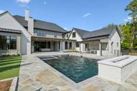 The pool is surround by a custom stone walkway.