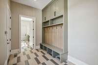 The mudroom features a built-in storage system for convenience as you enter and exit the home.