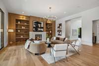 The charming white oak built-in bookshelves surround the fireplace, creating a timeless and sophisticated look.