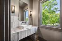 This picturesque bathroom is located across from the wet bar.