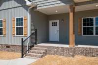 Enter through your covered porch! Bring your rocking chair, and enjoy the views!