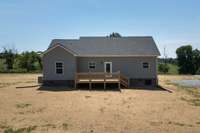 Large deck off the kitchen! Perfect place to relax and enjoy your 2.51 acre lot!