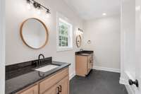 Stunning primary bath with double vanities and a tub/shower combo!