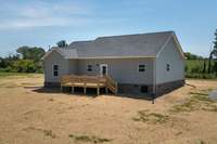 Large deck off the kitchen! Perfect place to relax and enjoy your 2.51 acre lot!