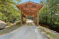 Drive over the iconic covered bridge to access your hidden gem lake community