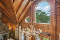 Gorgeous arched windows allow tons of natural light to flood the home and showcase the most beautiful view of the lake