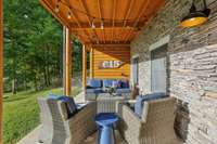 The lower level patio has more lounging space, a hot tub, and picnic table