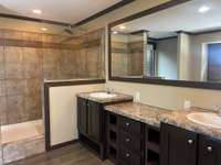 Master bedroom-double vanities, walk in shower, and soaker tub