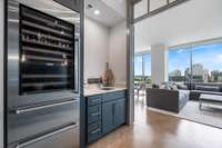 Study off living room with built-ins, full-size SubZero wine refrigerator and wet bar.