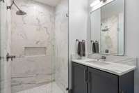 3rd bath with walk-in shower, marble tile and counters.