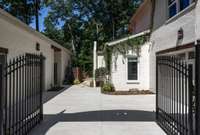 This gated entry adds security and privacy to your home, providing peace of mind and convenience. Imagine yourself driving through this grand entrance to your secluded retreat.